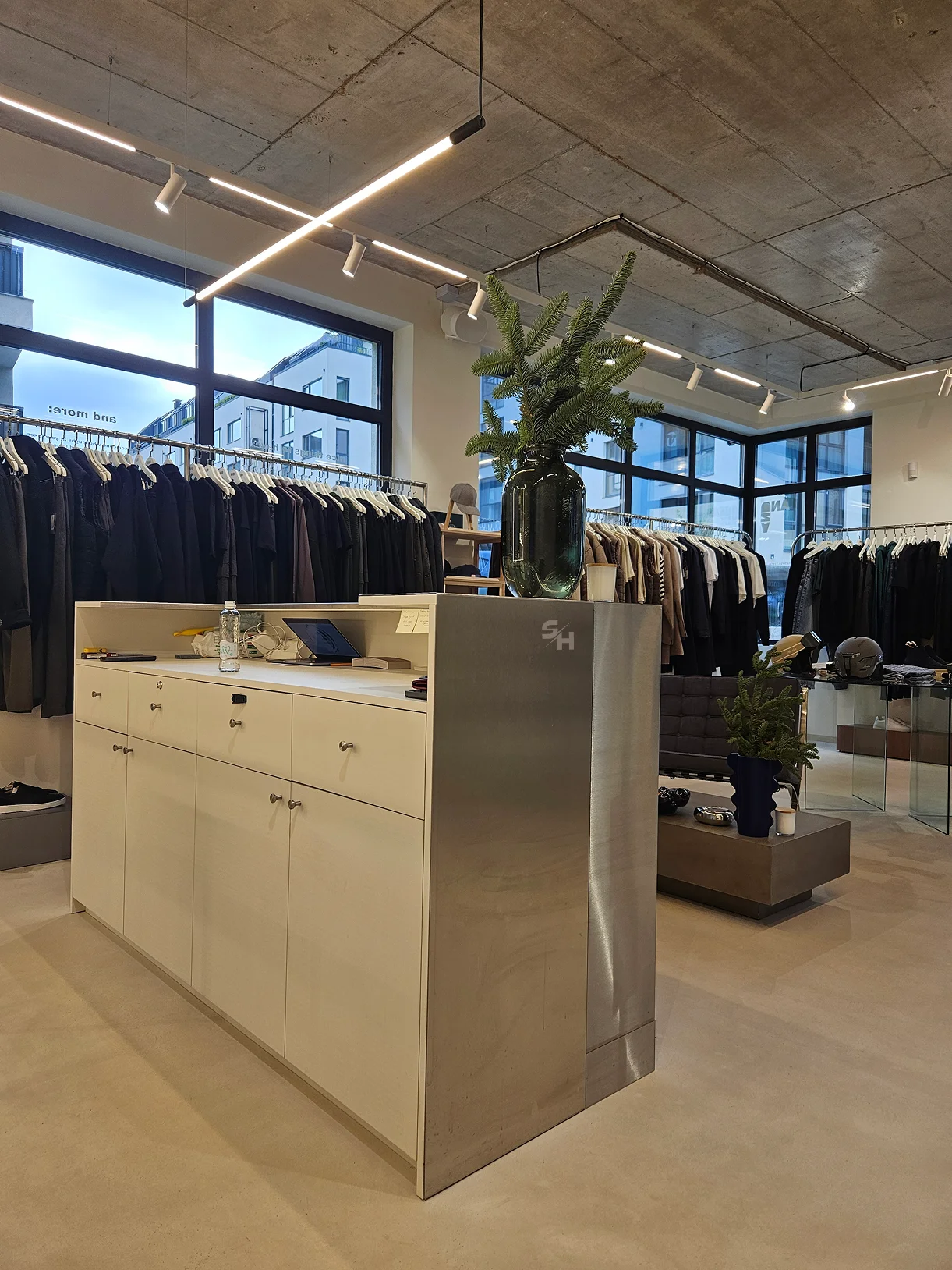 AND menswear store — counter, display alcoves and stair hall