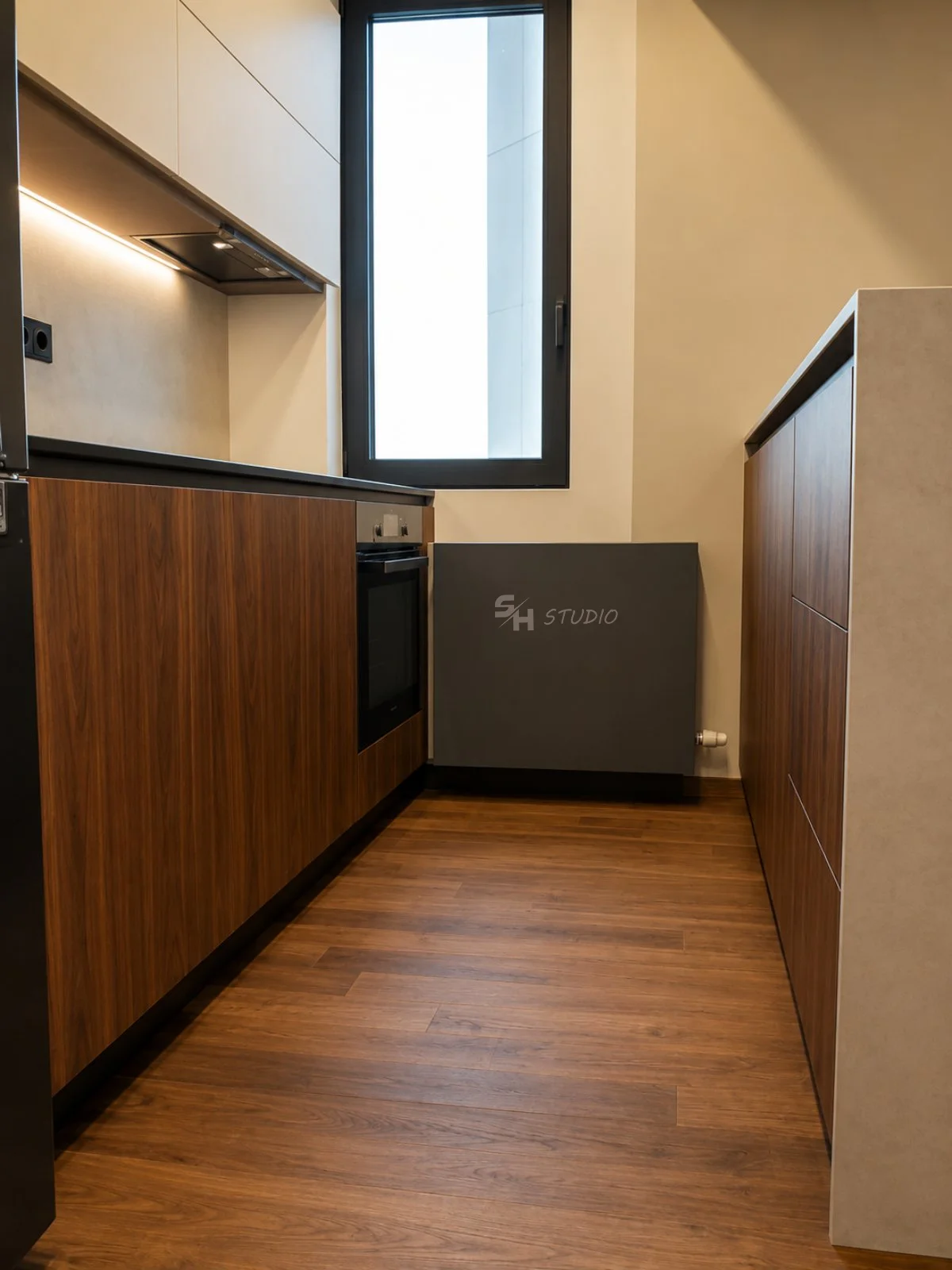 ADVH — kitchen box with walnut fronts, engineered stone island edge and concealed radiator cladding