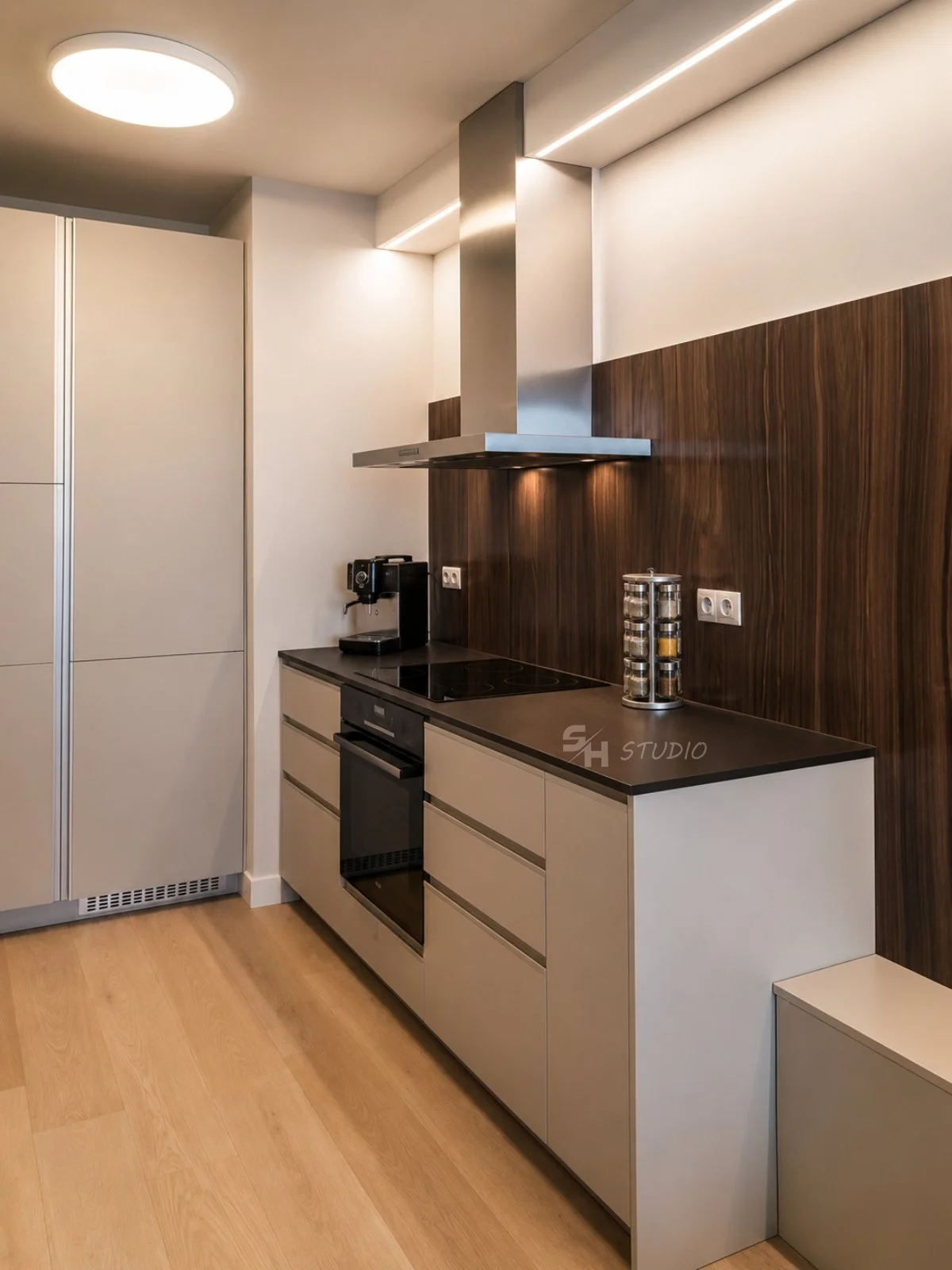 PSNG — kitchen with full-height storage units and dark worktop
