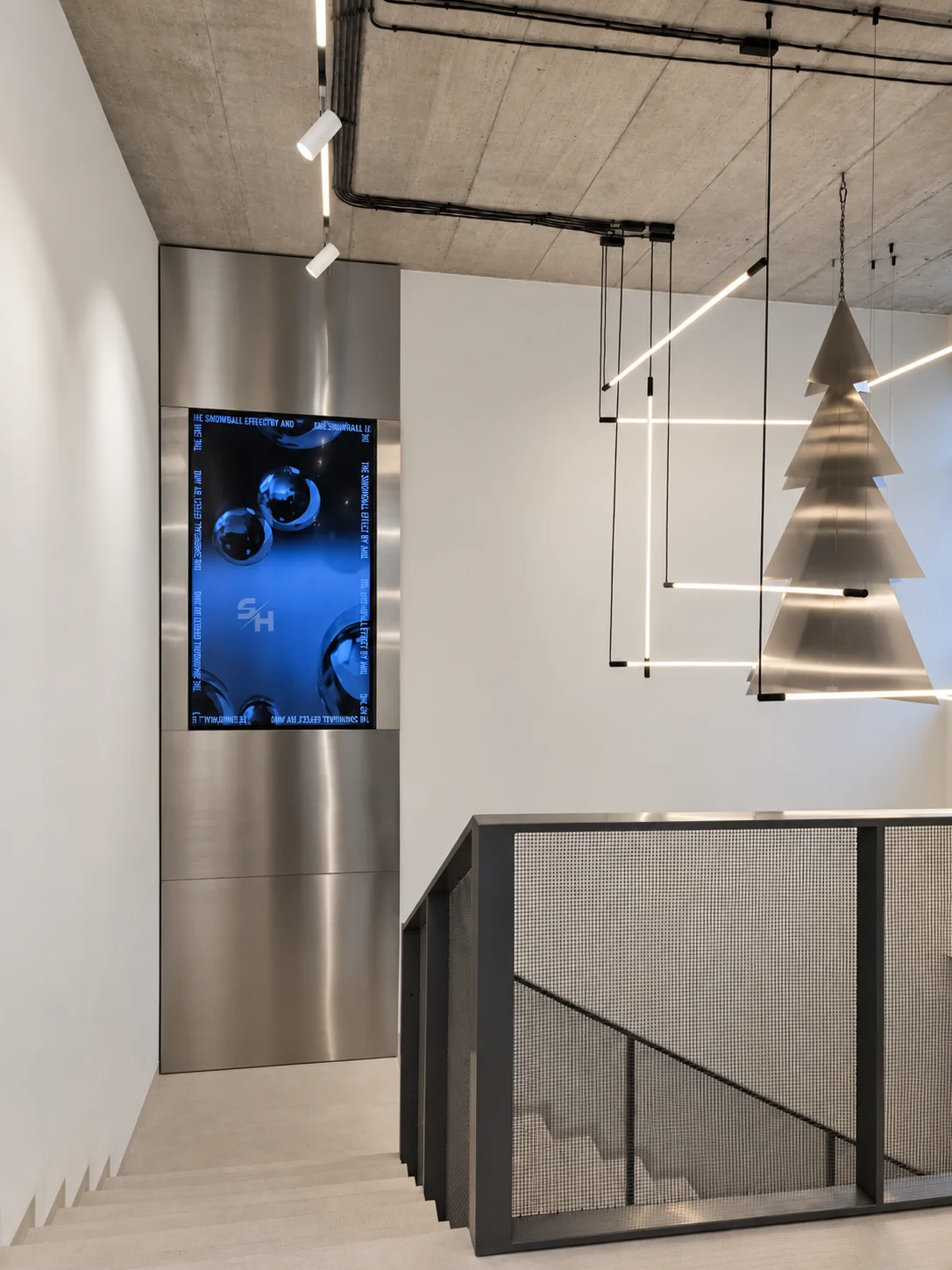 AND menswear store — counter, display alcoves and stair hall