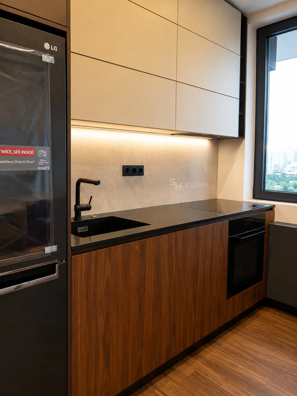 ADVH — kitchen run in walnut-veneered fronts with black worktop and stone-effect backsplash