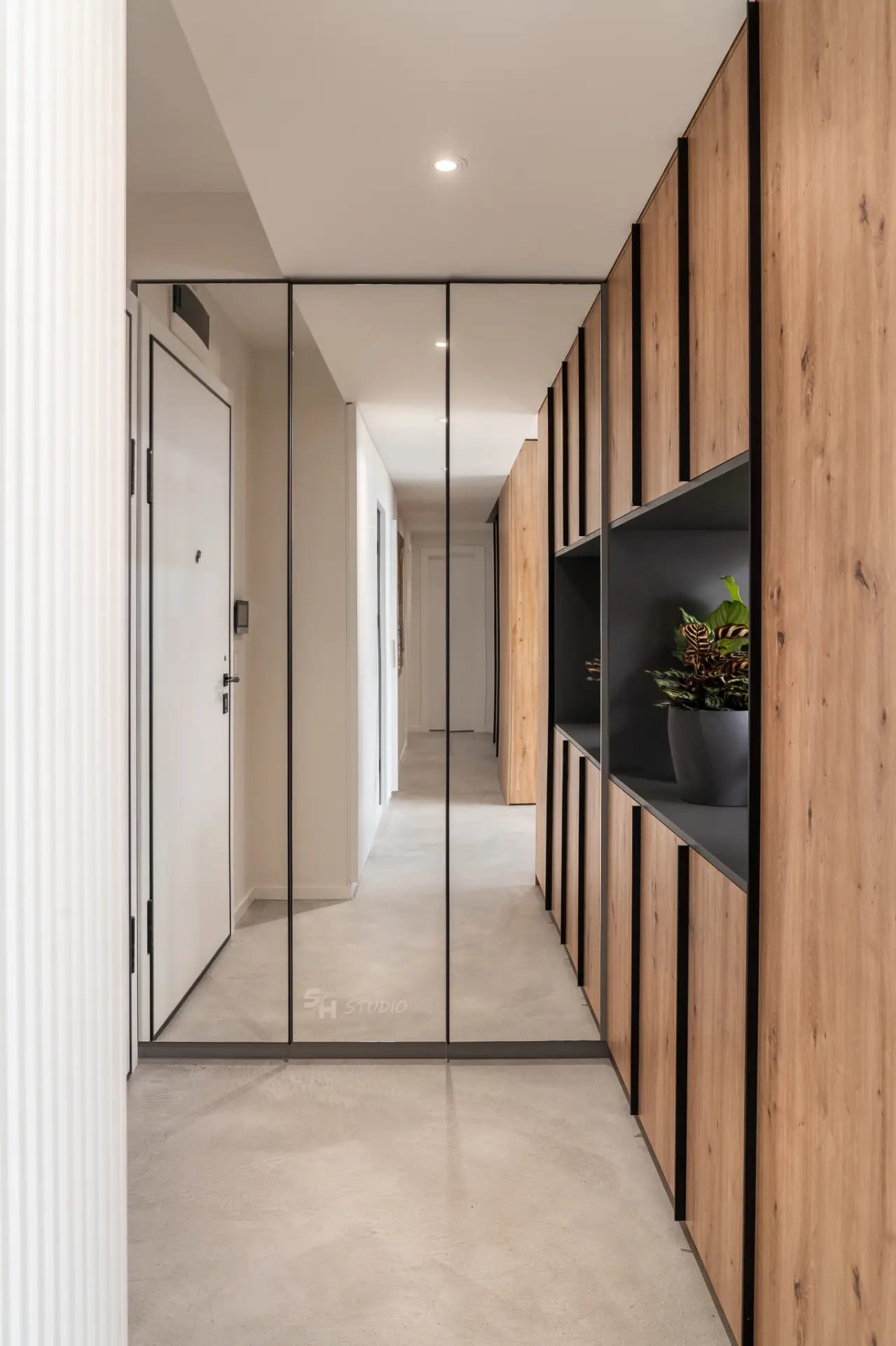 PHOBIA — entrance hall with mirrored wardrobe and full-height timber cabinetry