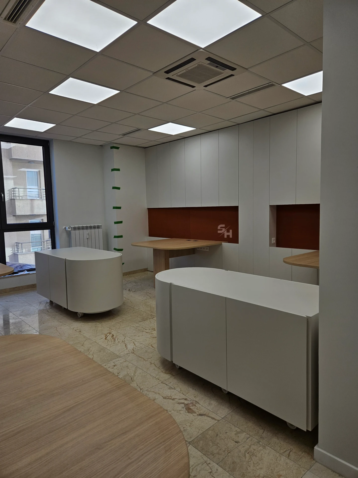 VDR Office — creative workspace with curved desks, filing wall and mobile curved cabinet