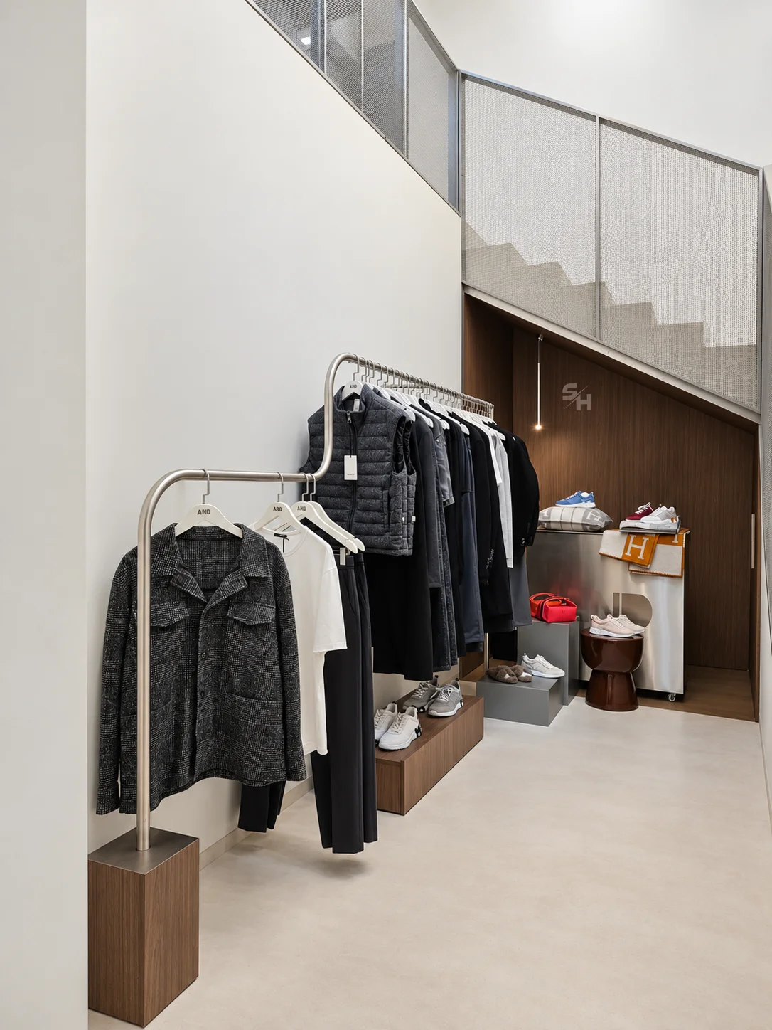 AND menswear store — counter, display alcoves and stair hall