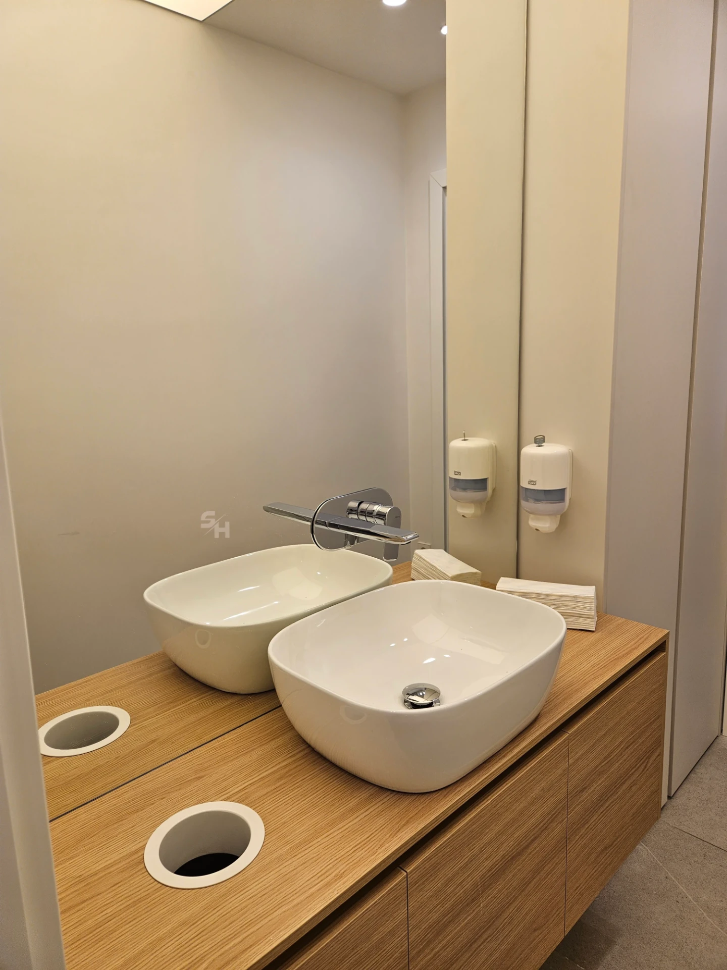 VDR Office — WC lobby with cantilevered waterproof PVC sink counter and mirrored wall