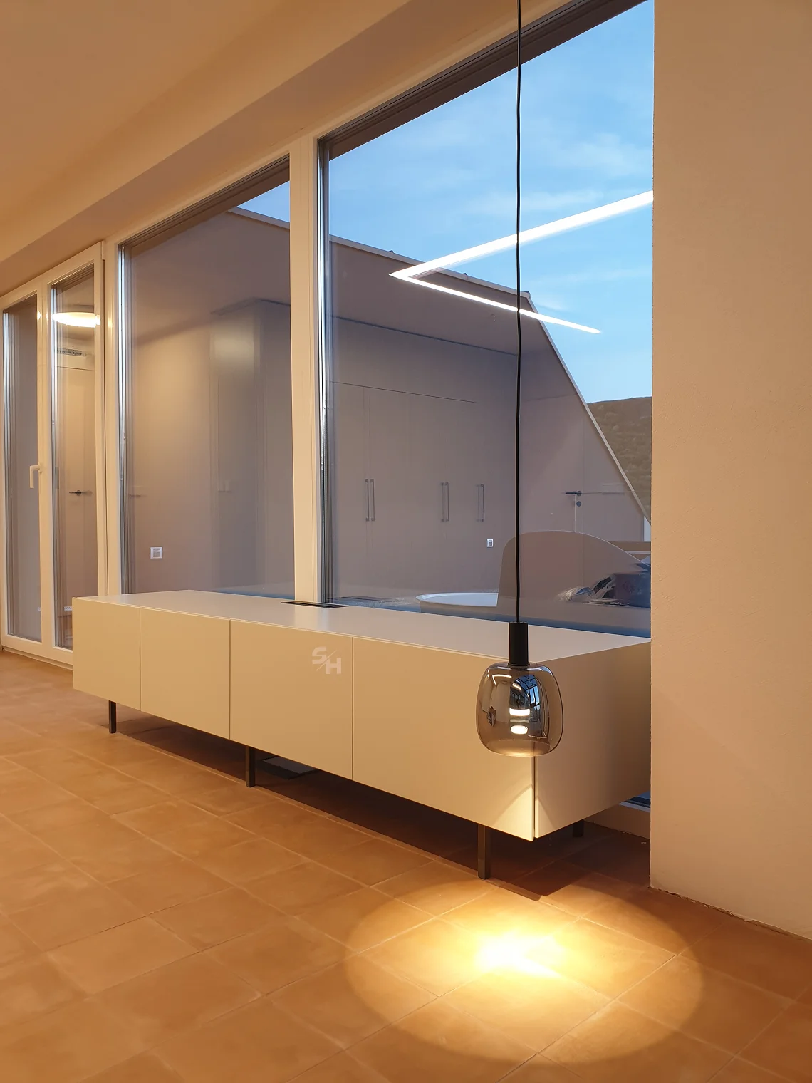 PSLR — kitchen, living and dining area in sandy tones with natural veneer