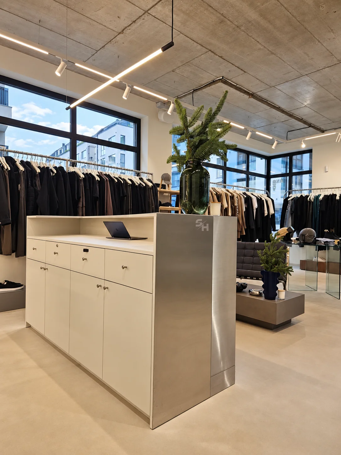 AND menswear store — counter, display alcoves and stair hall