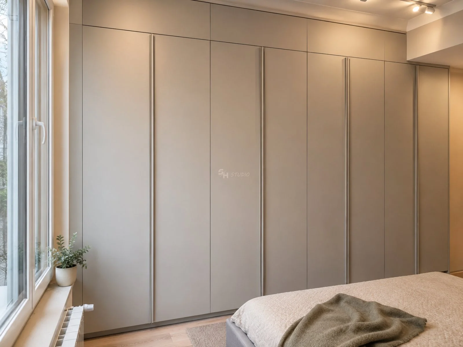 PSHM Residence — closed full-height fitted wardrobe beside the bed