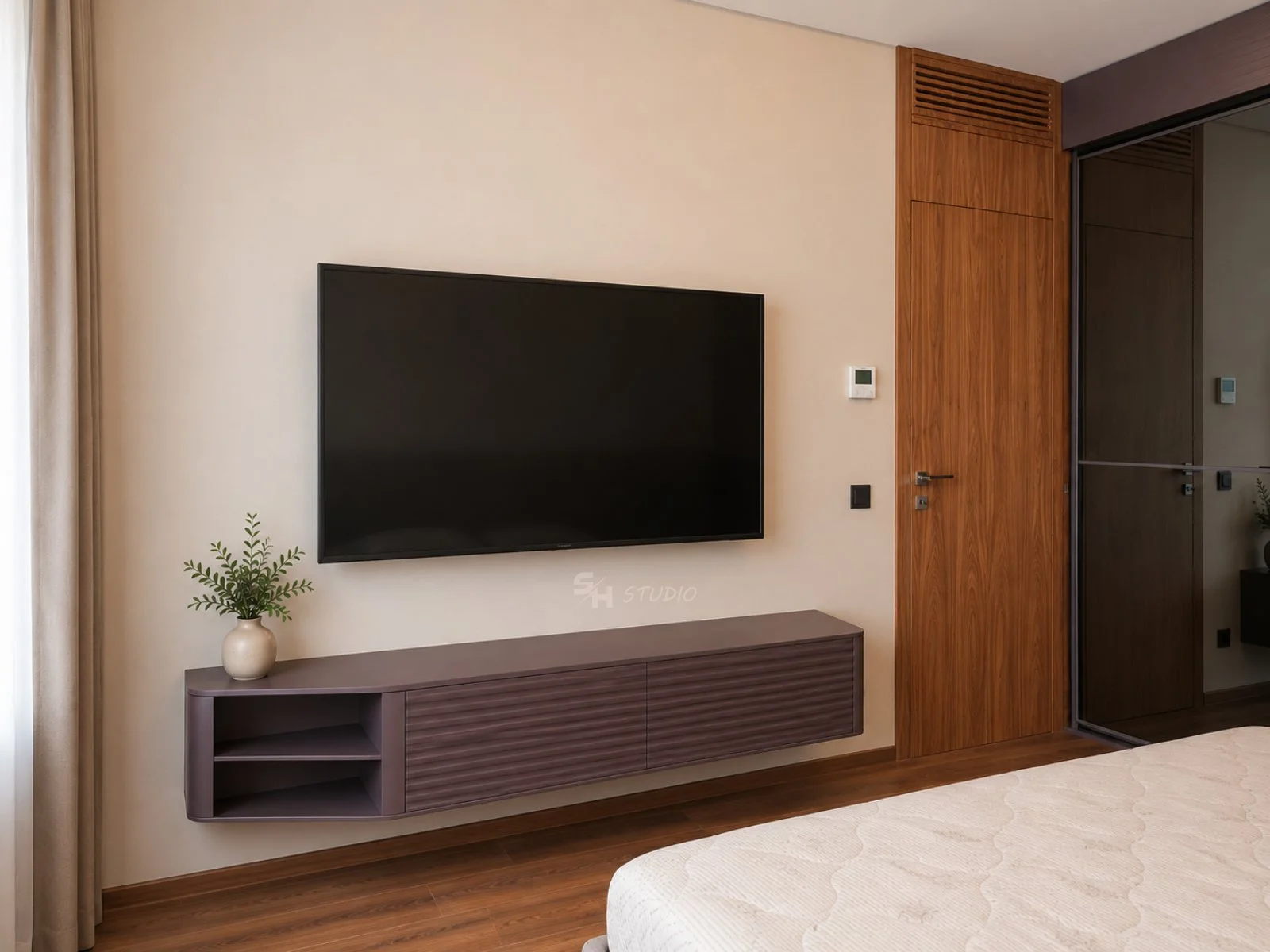 ADVH — wall-mounted TV cabinet with routed door fronts in the guest room