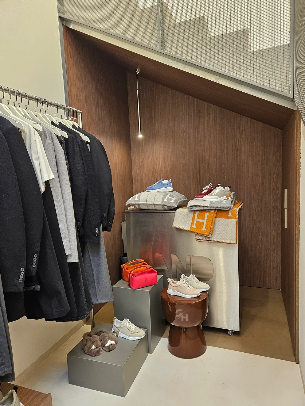 AND menswear store — counter, display alcoves and stair hall