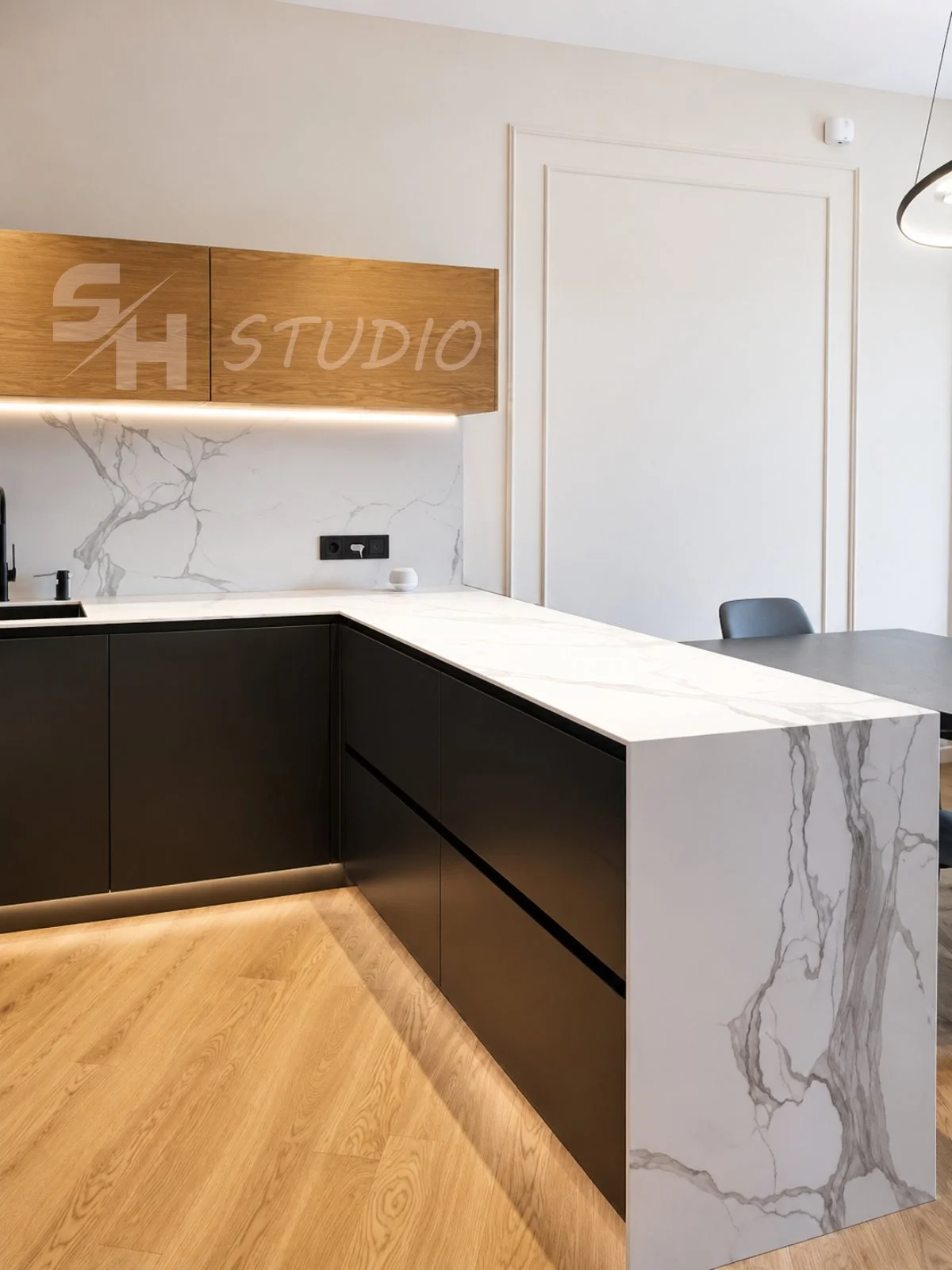 MMK Residence — kitchen peninsula with stone waterfall edge