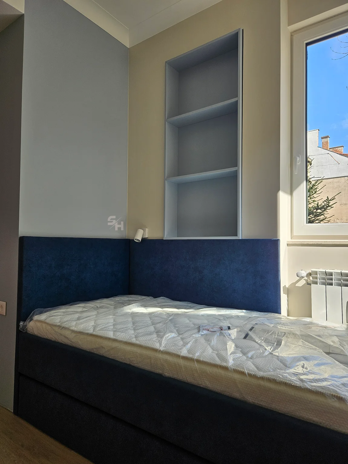 PSHM — upholstered bed and shelving in the children's room