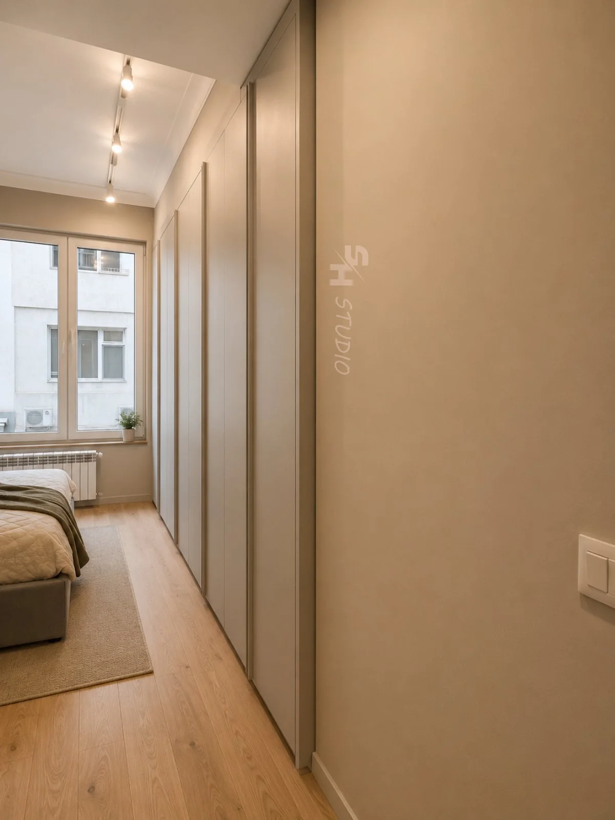 PSHM Residence — bedroom with a full-height fitted wardrobe