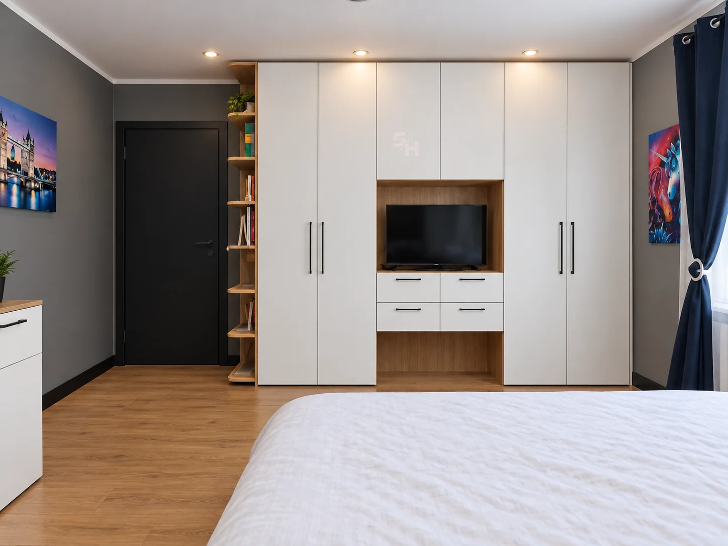 IATA — white built-in wardrobe with central TV niche and corner shelving