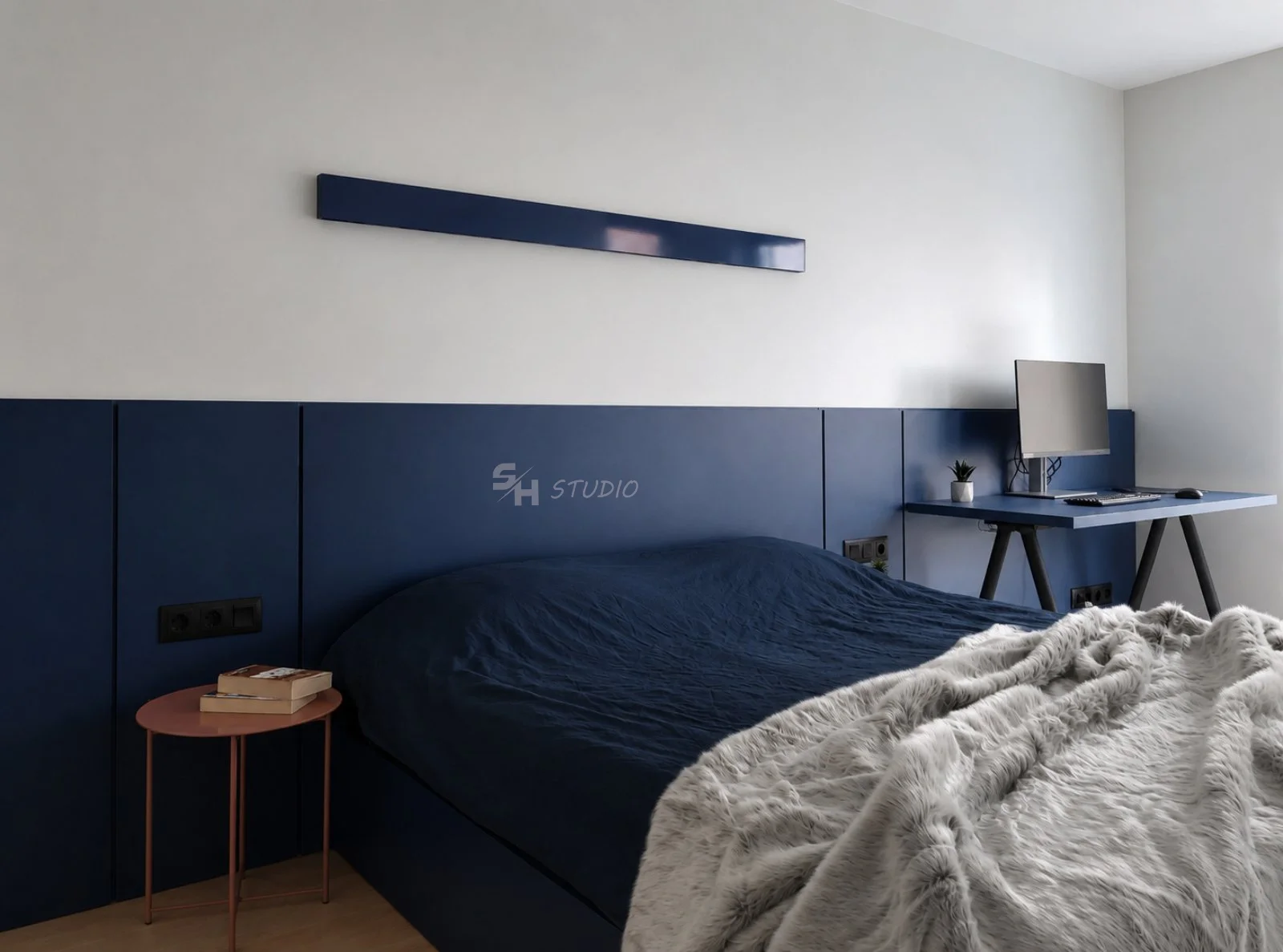 ETS1 — bedroom with dark blue headboard panelling and integrated desk