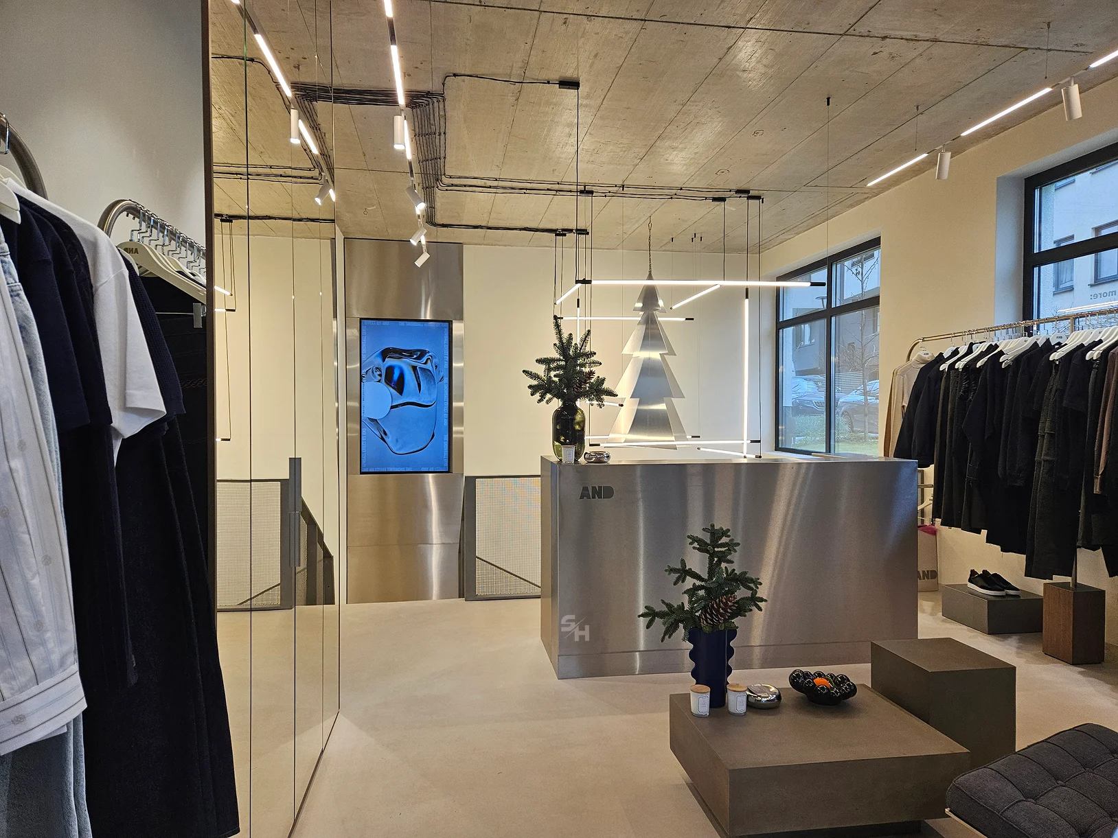 AND menswear store — counter, display alcoves and stair hall