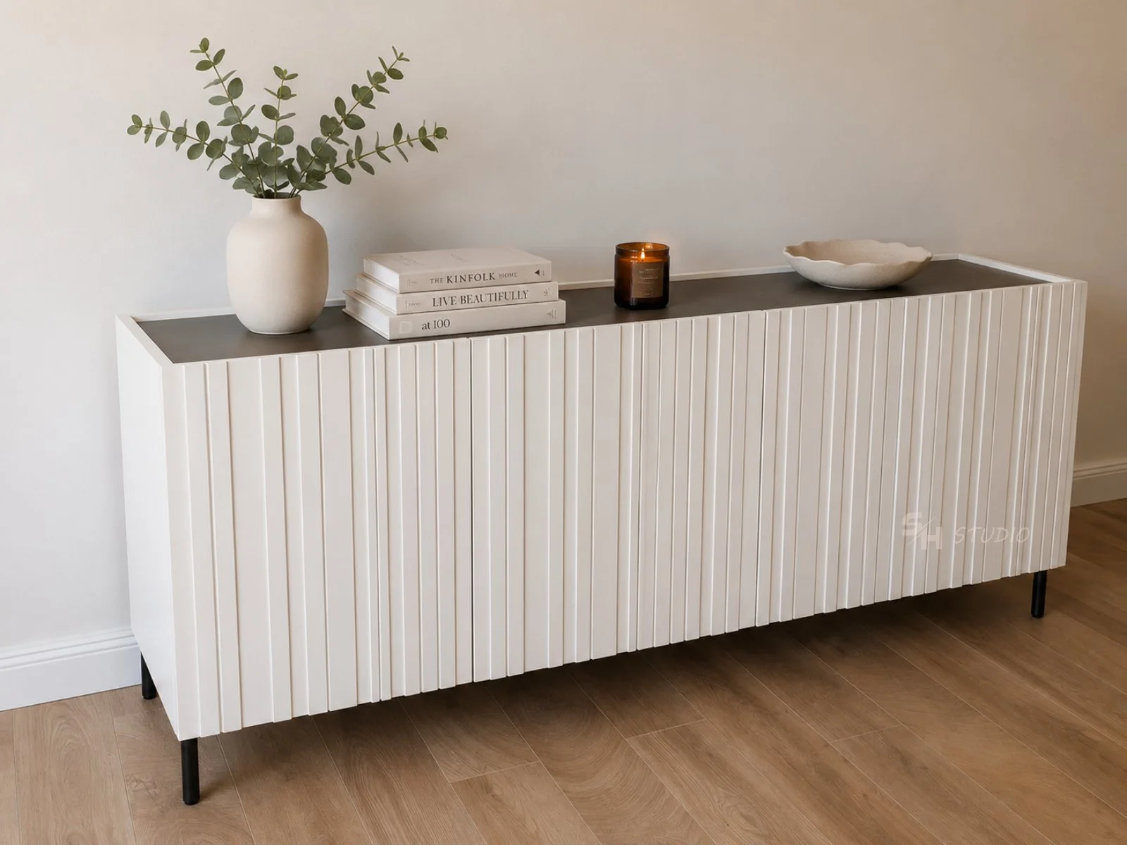 KDKS — low cabinet with routed door fronts and a black metal base