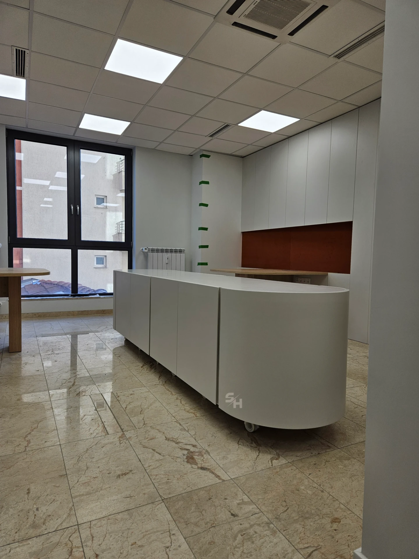 VDR Office — creative workspace with curved desks, filing wall and mobile curved cabinet