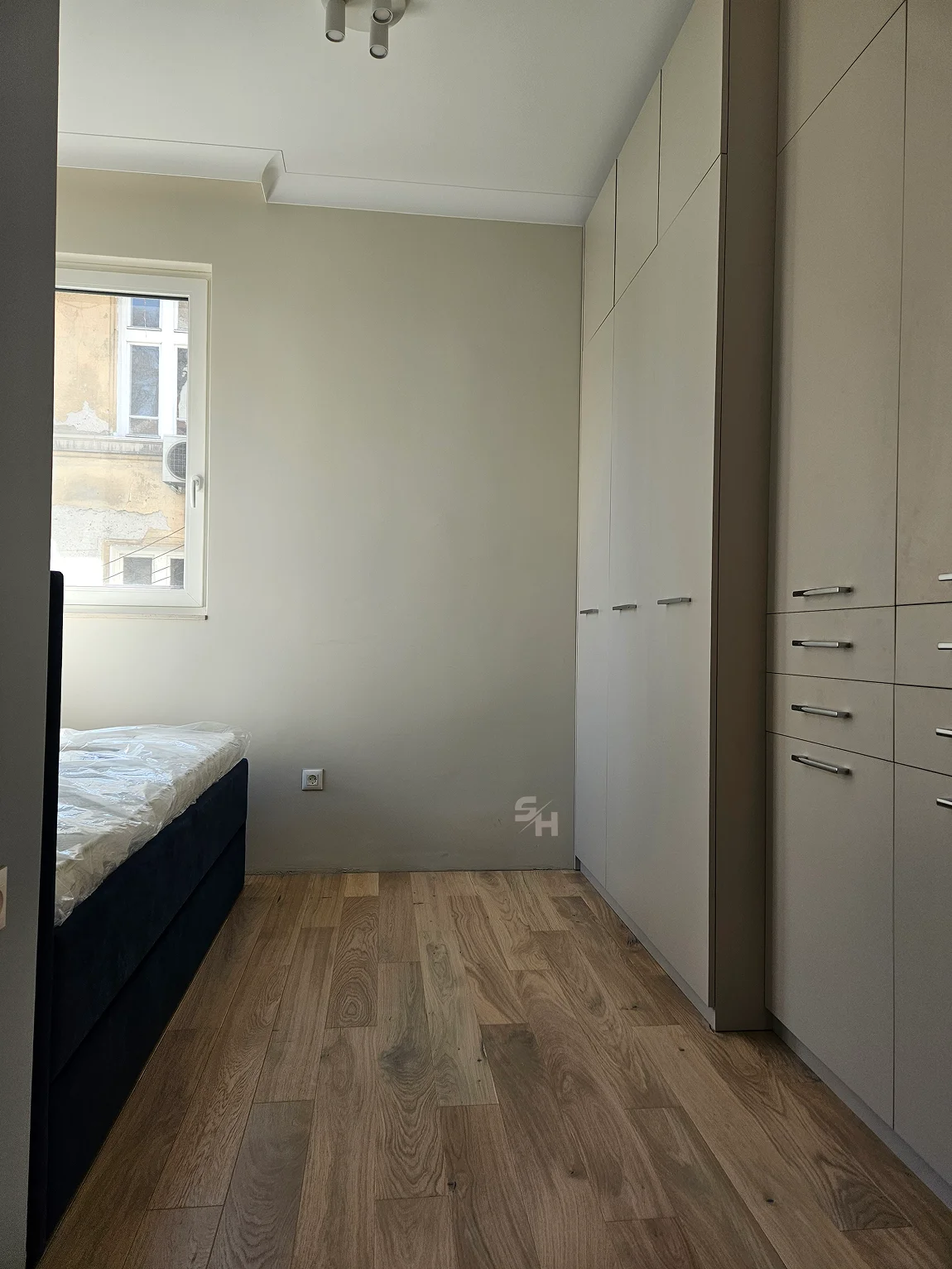 PSHM — fitted bedroom wardrobes beside the window