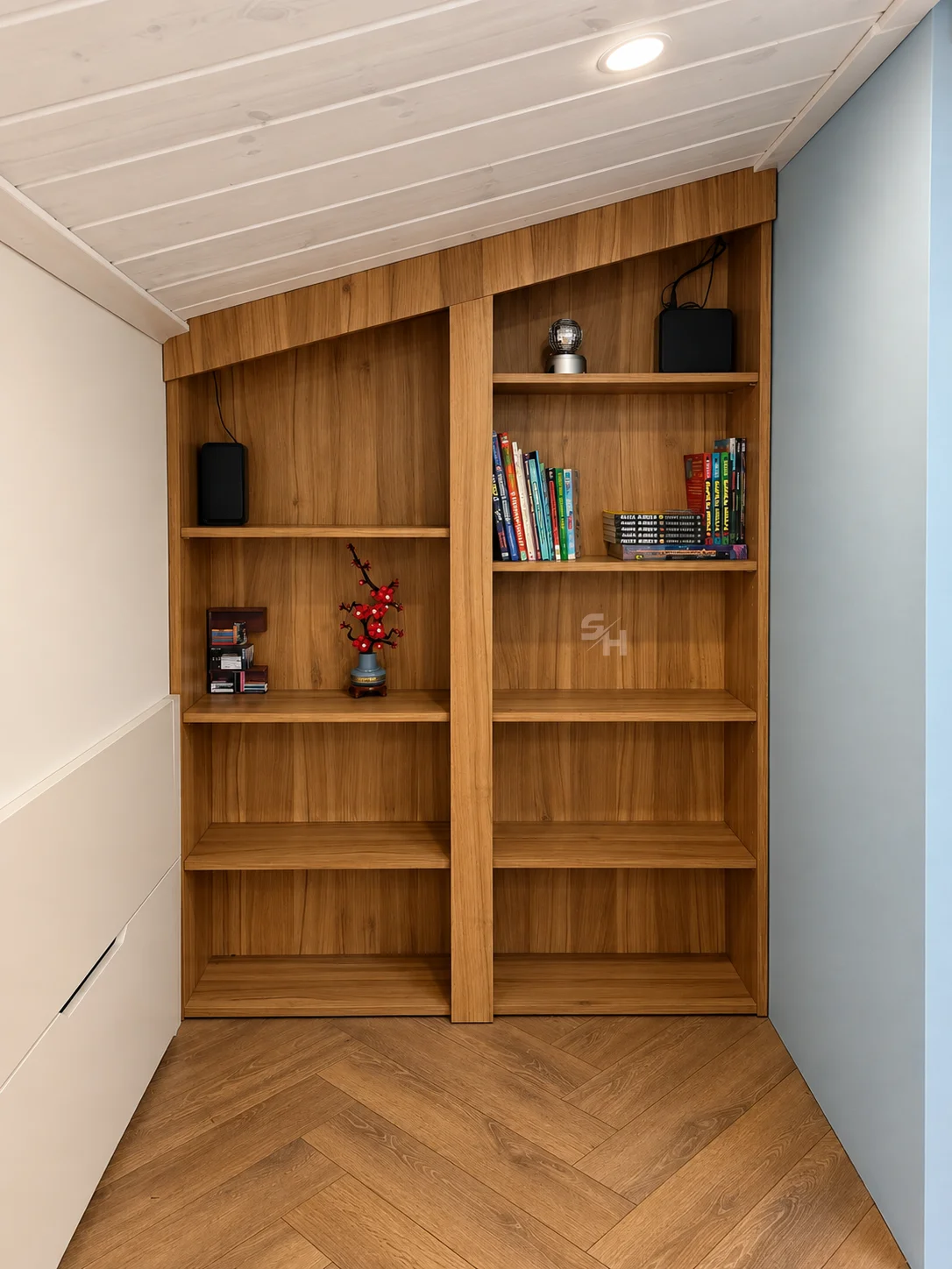 Attic Spaces — wood-grain shelving and drawers fitted beneath the sloped ceiling