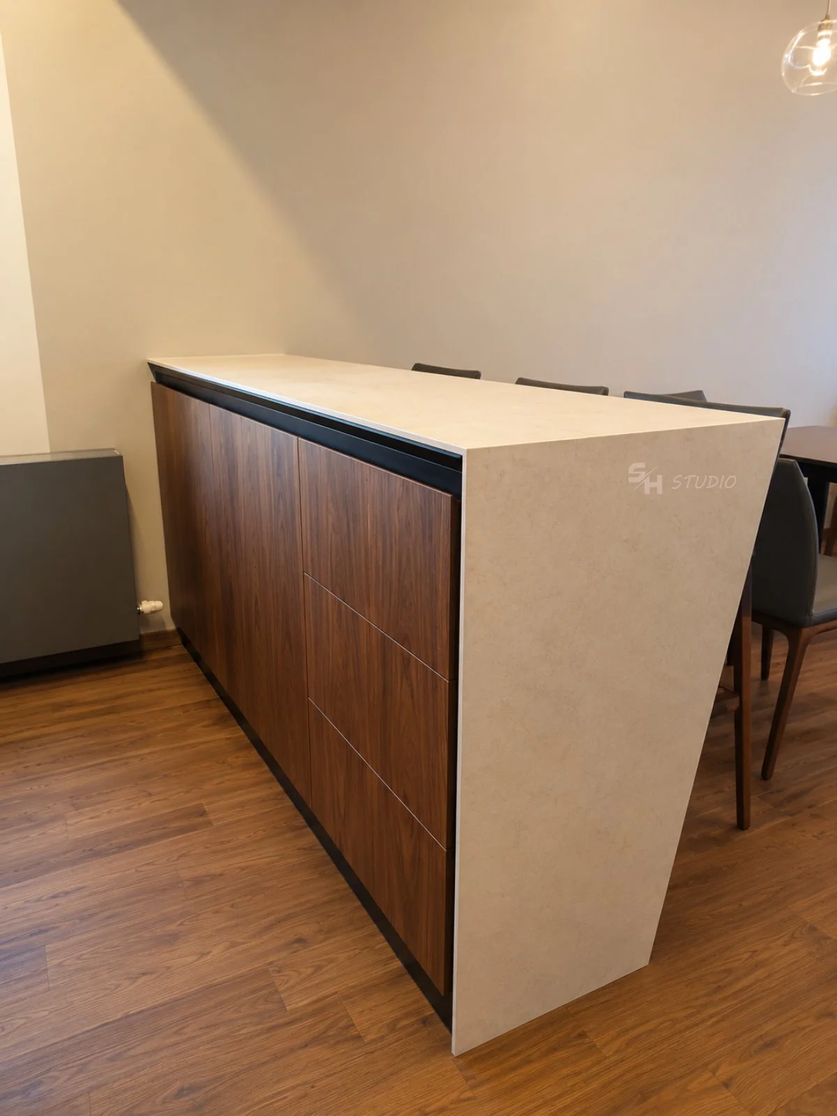 ADVH — island front in engineered stone over walnut drawer units
