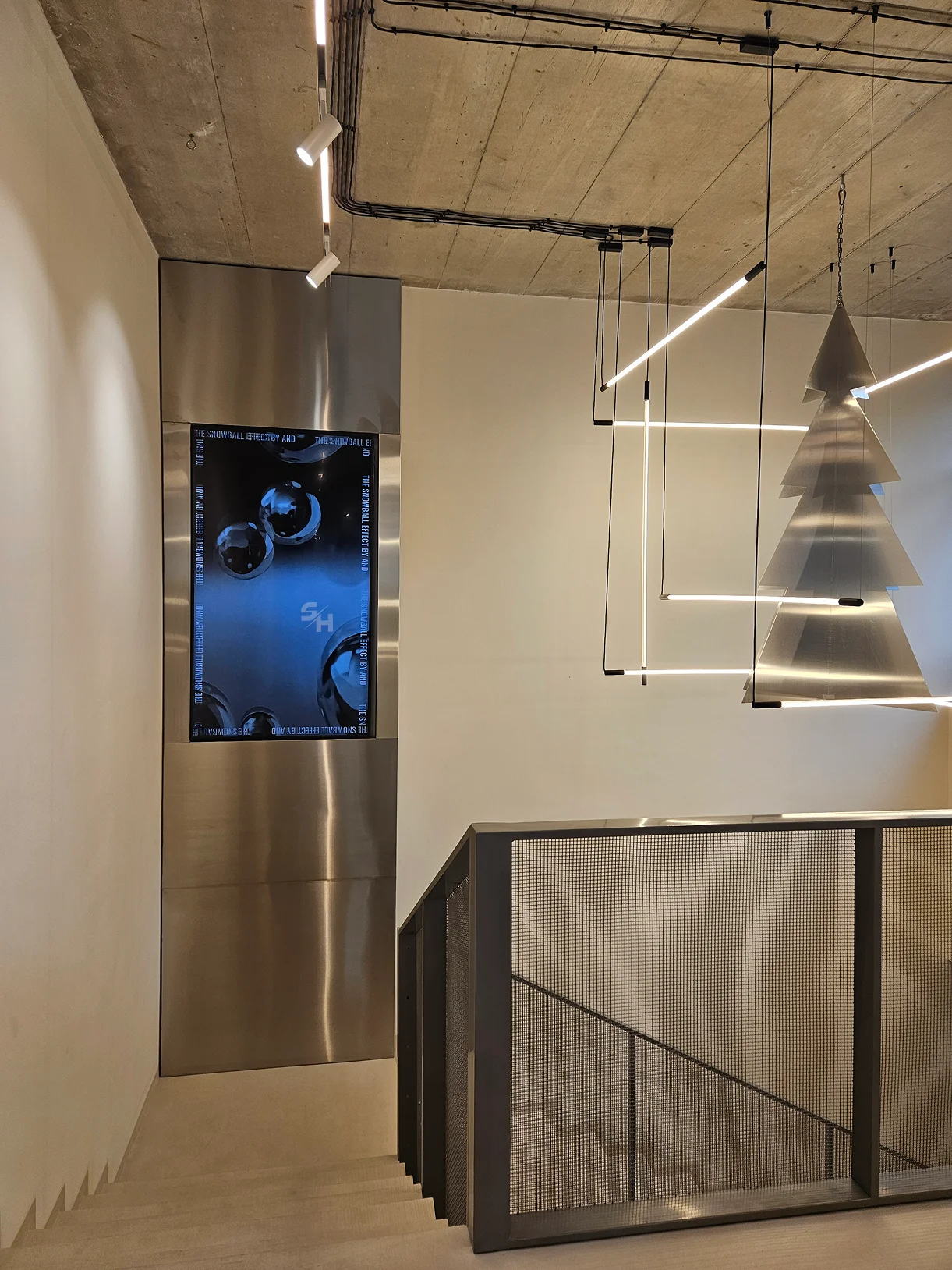 AND menswear store — counter, display alcoves and stair hall