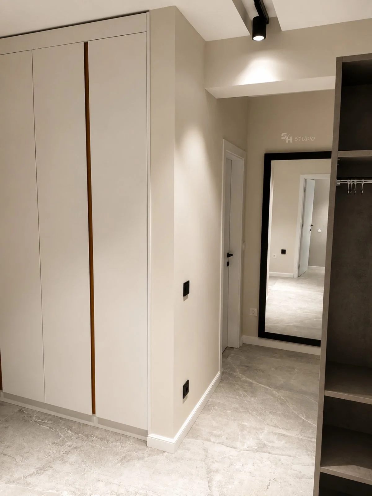 KDIA — built-in hallway wardrobe with contrasting vertical detail