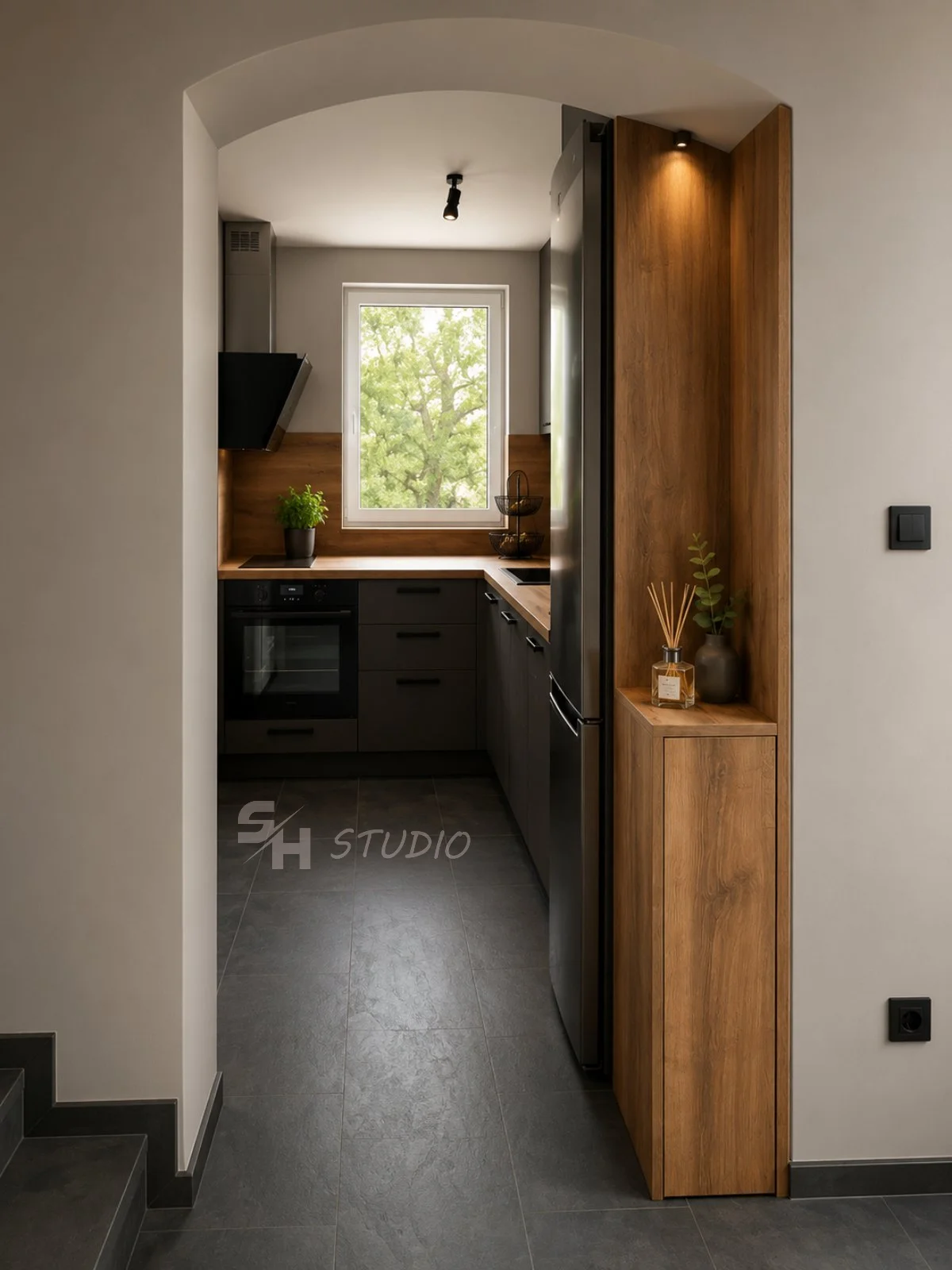 DD Residence — kitchen entrance with oak-effect tall unit and niche