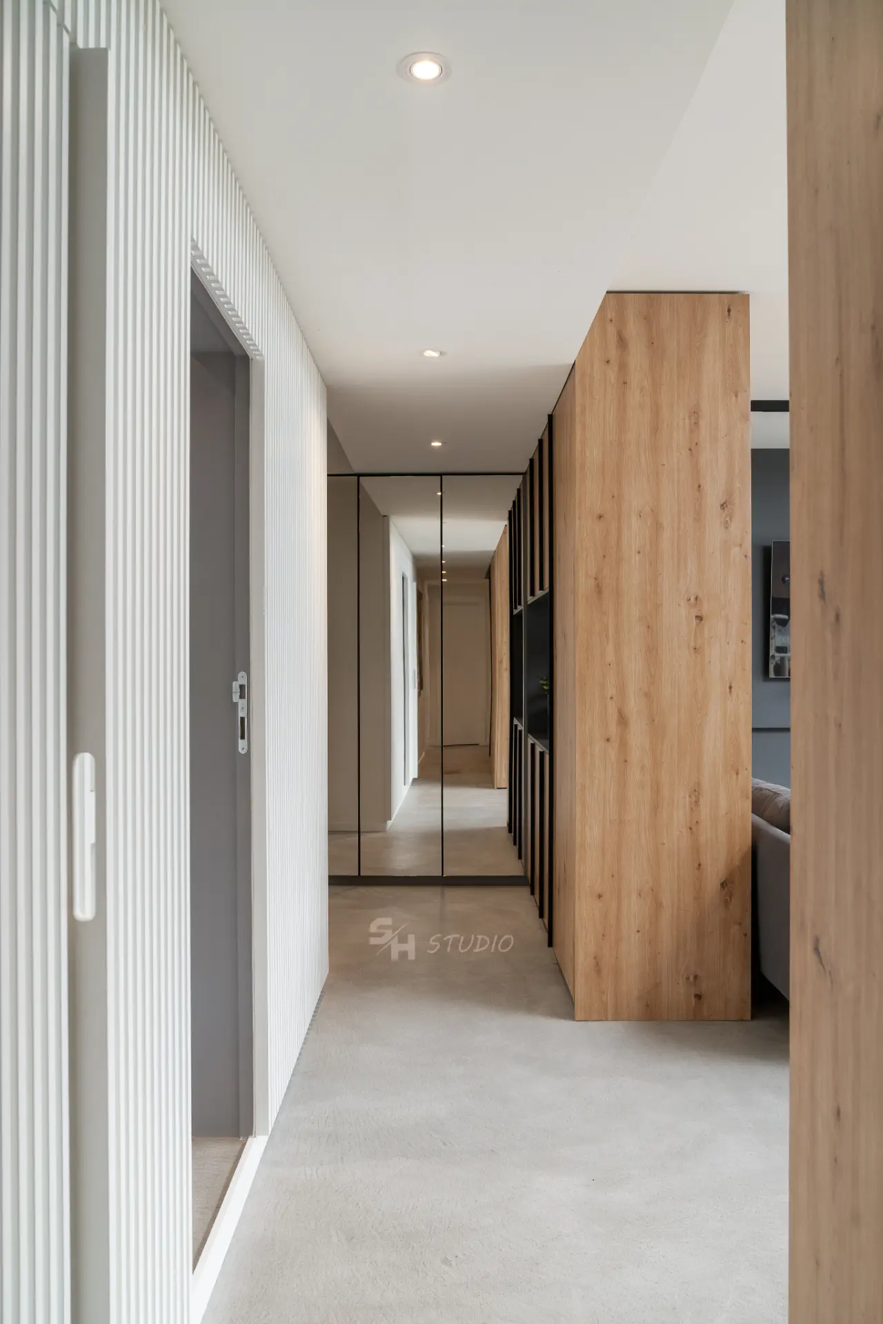 PHOBIA — entrance hall with mirrored wardrobe, timber cabinetry and concealed fluted doors