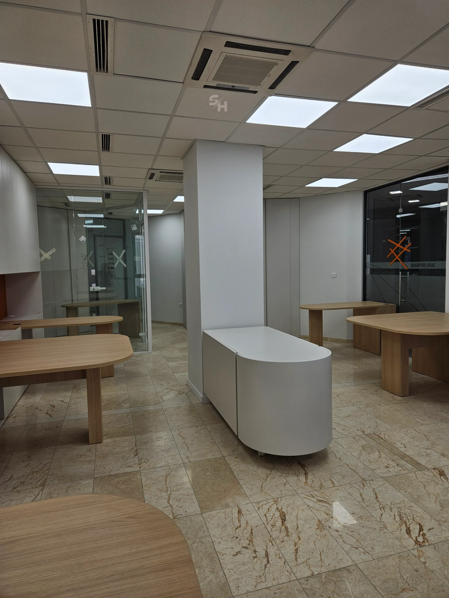 VDR Office — creative workspace with curved desks, filing wall and mobile curved cabinet