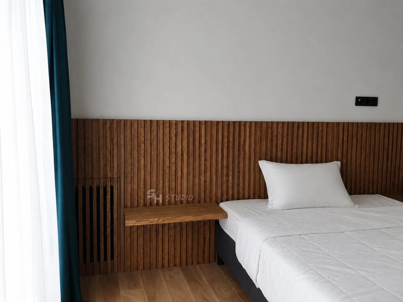 KDKS — guest room with low oak-slat panelling acting as a headboard with a console shelf