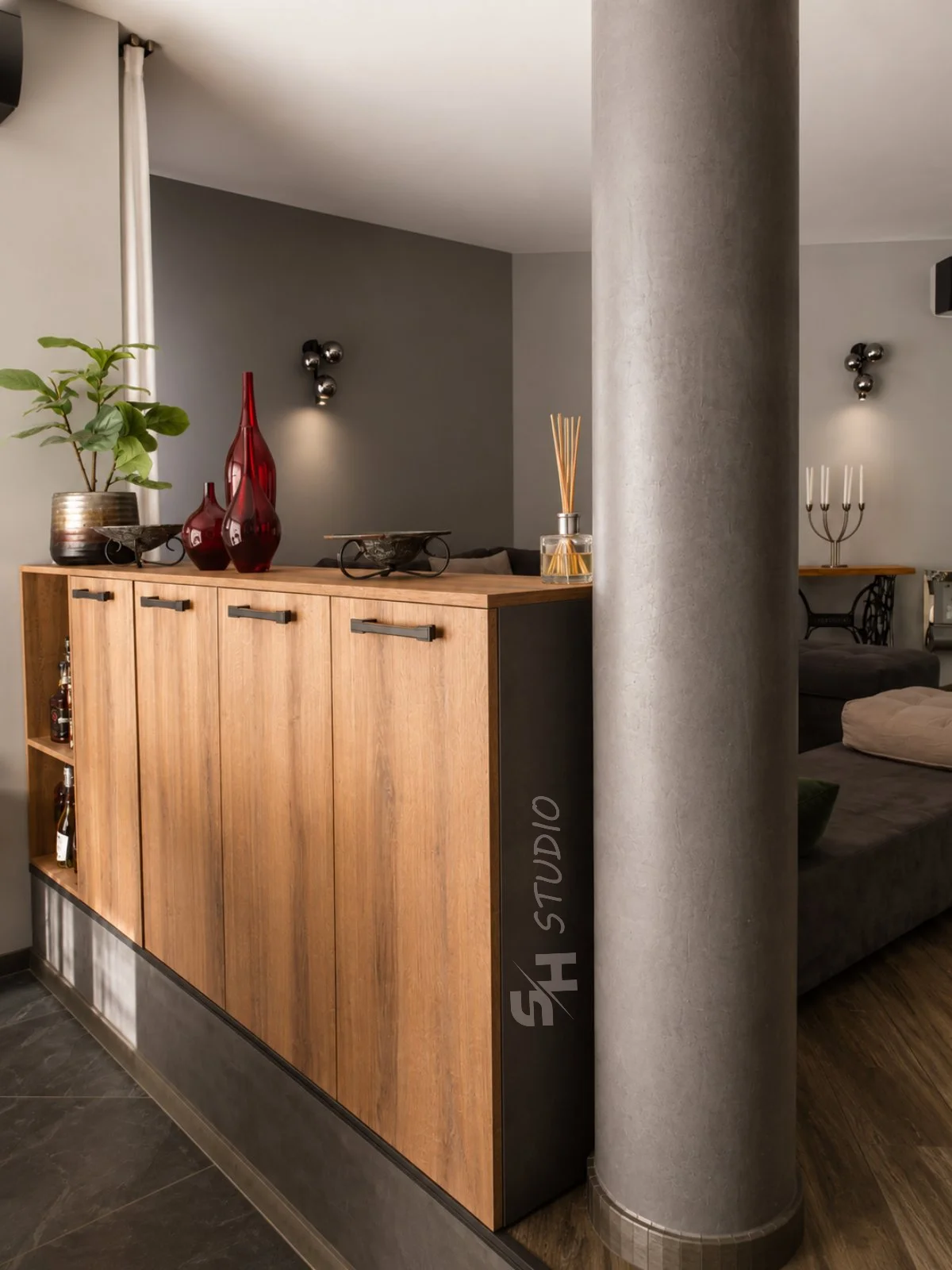 DD Residence — oak-effect living-room storage beside the structural column