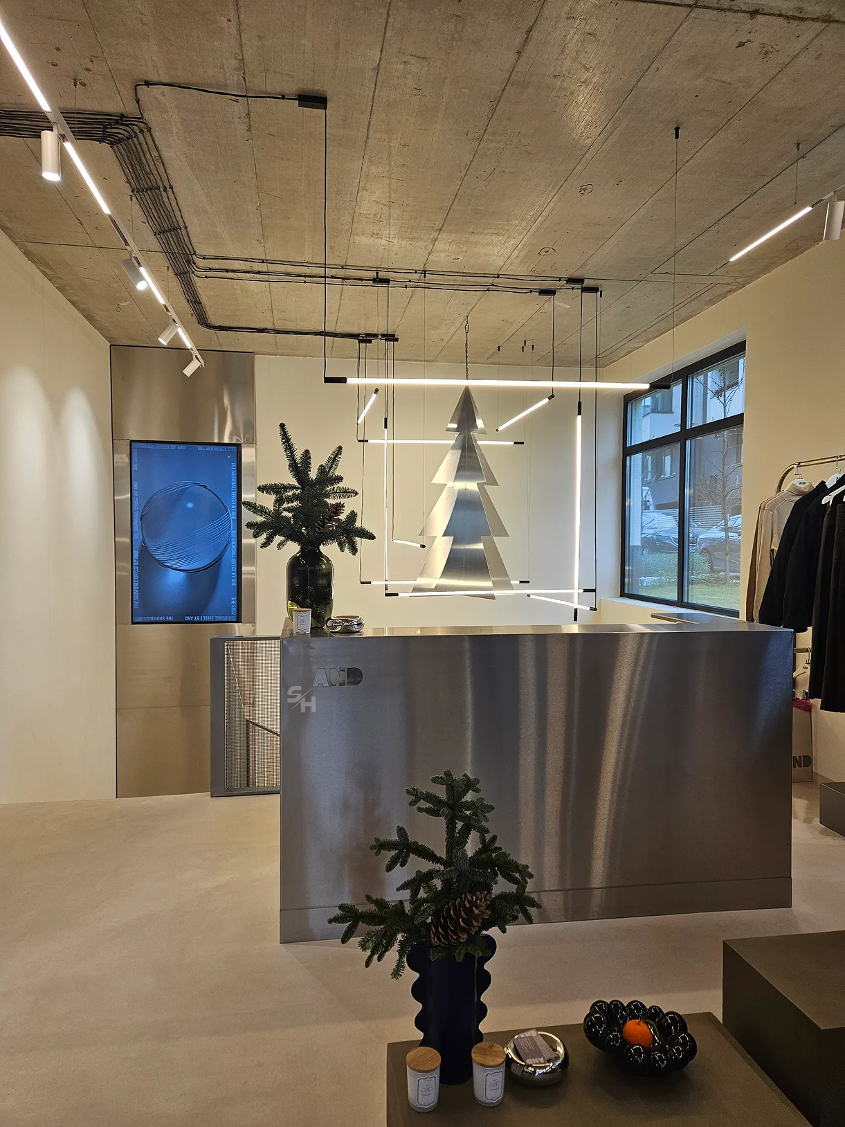 AND menswear store — counter, display alcoves and stair hall
