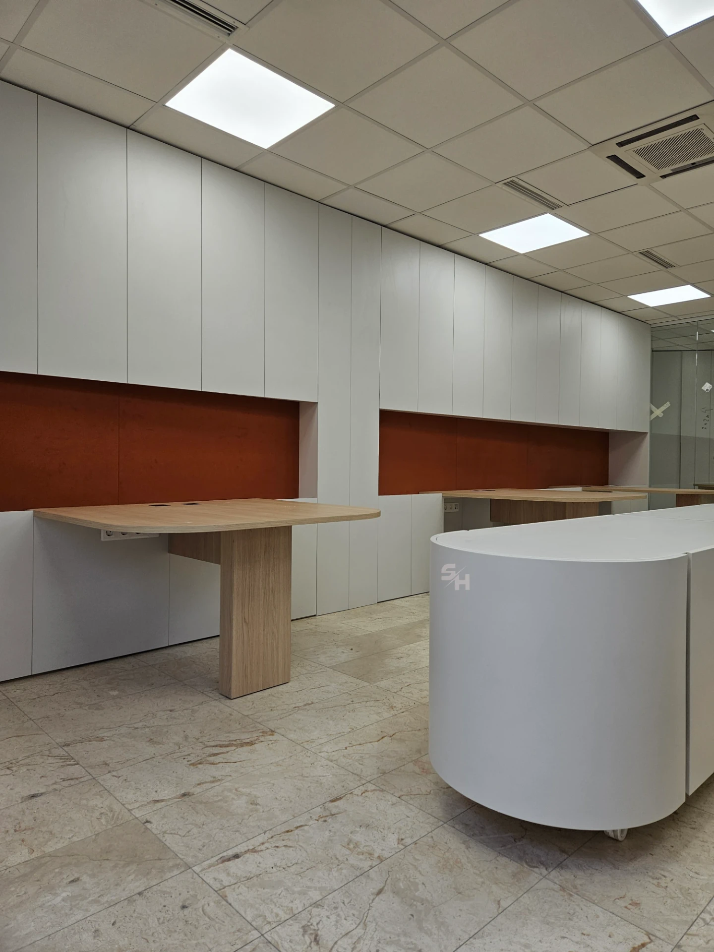 VDR Office — creative workspace with curved desks, filing wall and mobile curved cabinet