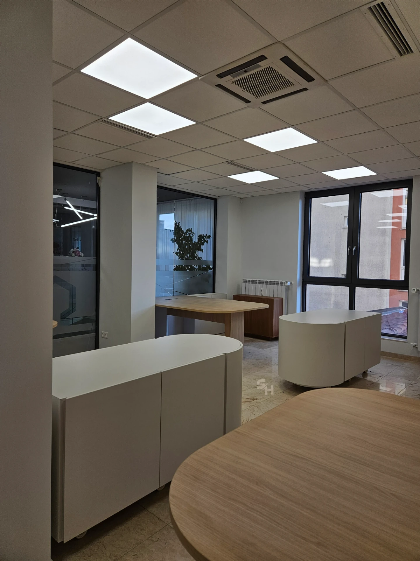 VDR Office — creative workspace with curved desks, filing wall and mobile curved cabinet