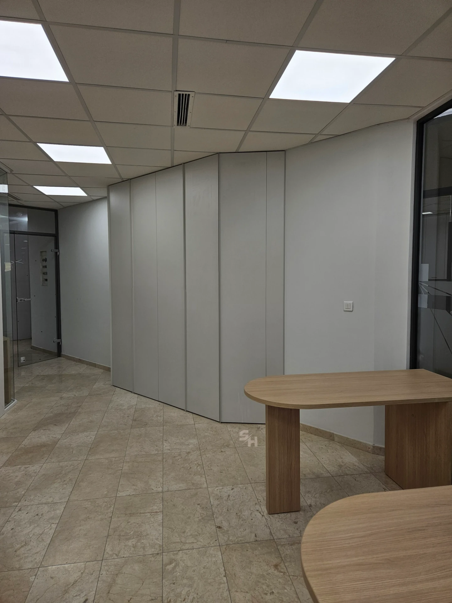VDR Office — creative workspace with curved desks, filing wall and mobile curved cabinet