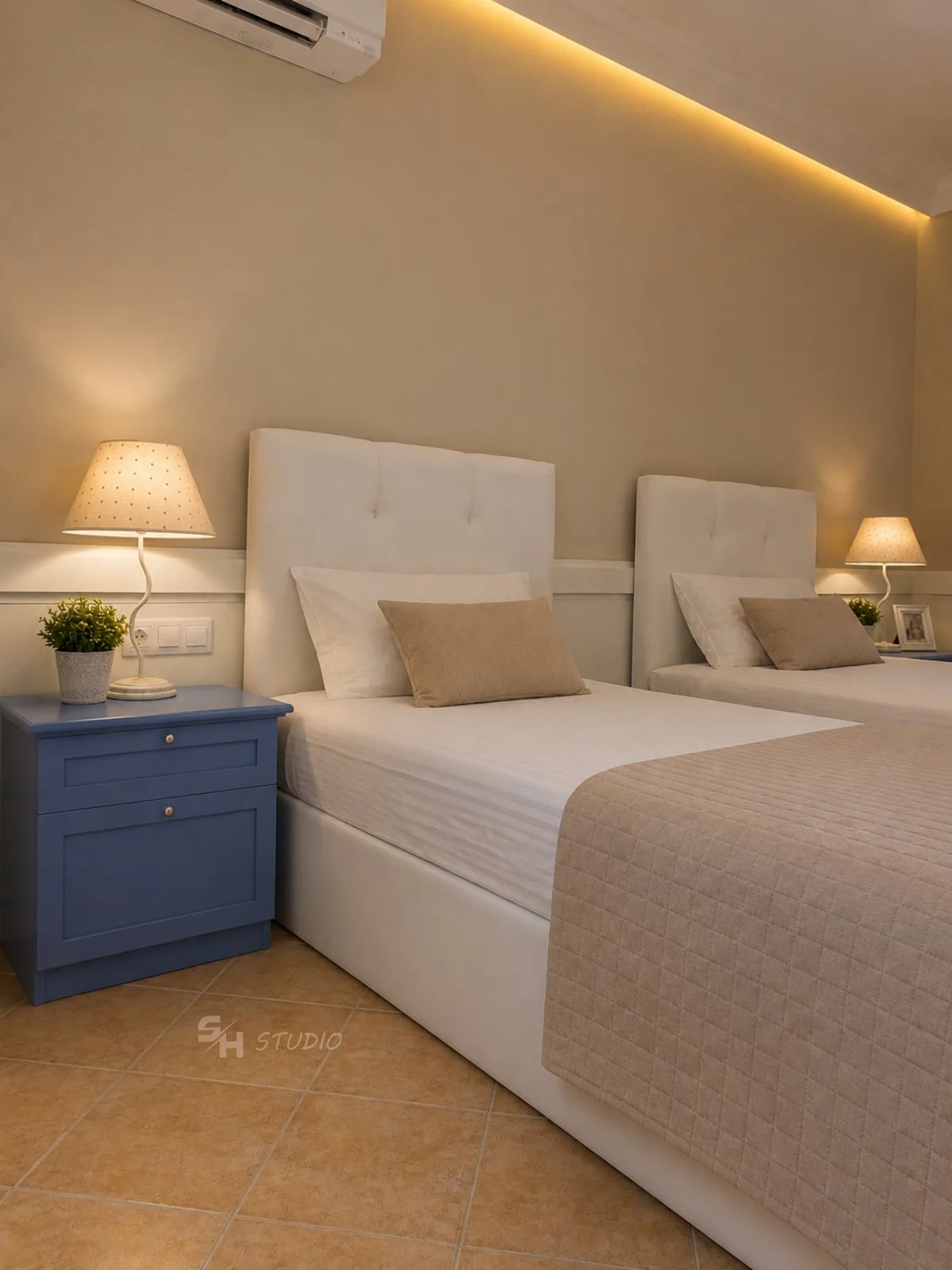 DIYT Apartment — upholstered single beds with framed painted bedside cabinets