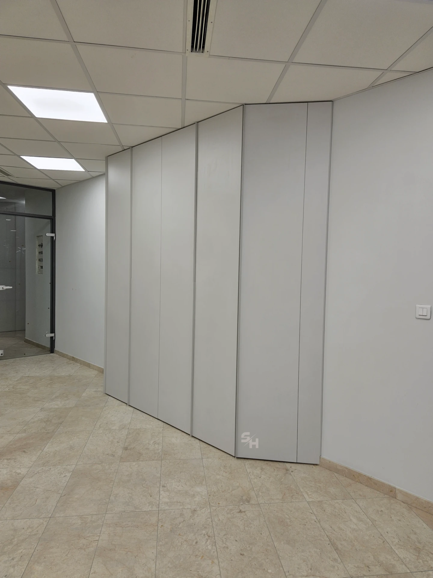 VDR Office — creative workspace with curved desks, filing wall and mobile curved cabinet